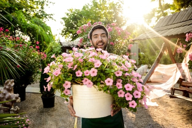 A person joyfully tending to a garden, surrounded by lush greenery and colourful flowers, on a bright, sunny day.