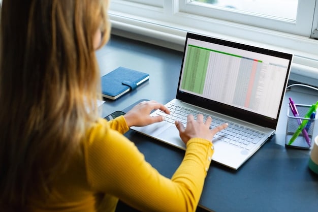 A close-up on a laptop screen displaying a student loan account summary with the outstanding balance clearly visible. Graphs indicating repayment progress are also shown.