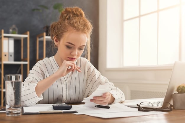 A person smiling confidently while using a calculator and reviewing financial documents, symbolizing control over their student loan debt.