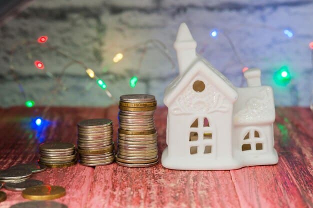 A stack of coins next to a miniature house, with a calculator in the background. The lighting is soft and warm.