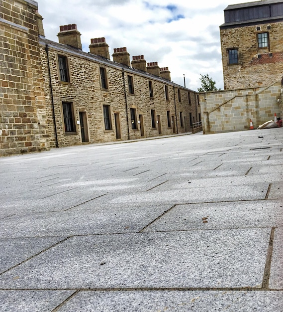 A freshly installed tarmac driveway on a sunny day.