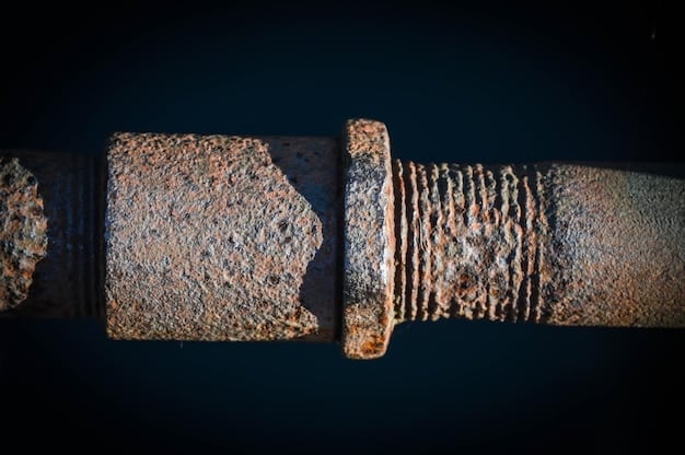 Close-up of a corroded pipe interior, heavily scaled with mineral deposits from hard water, showing the restricted water flow and potential for leaks.