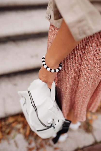 A close-up shot showcasing versatile Shein accessories like necklaces, earrings, a belt, and a small handbag, neatly arranged to highlight how they can transform multiple outfits.