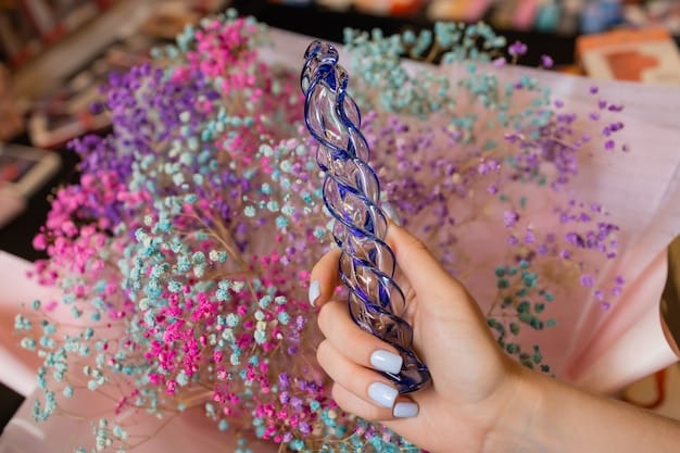 A close-up shot of a festival-goer's hands adorned with stacked rings and bracelets, holding a unique, handcrafted flower crown made from vibrant artificial flowers and delicate beads.