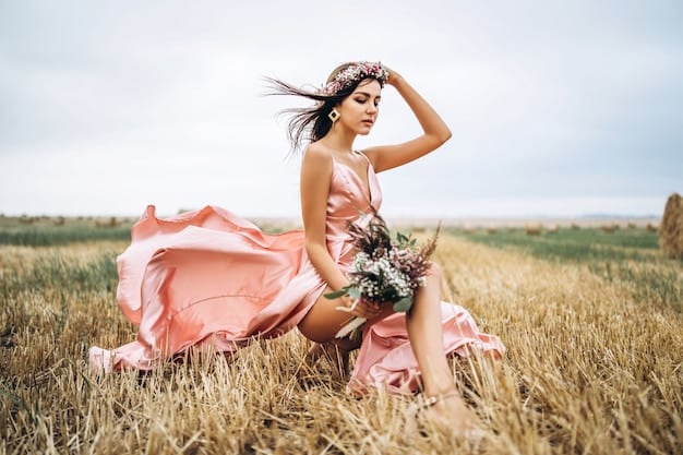 A woman with long wavy hair, wearing a loose floral maxi dress, adorned with layered necklaces, beaded bracelets, a wide-brimmed straw hat, and fringed ankle boots, under a sunny sky in a field.
