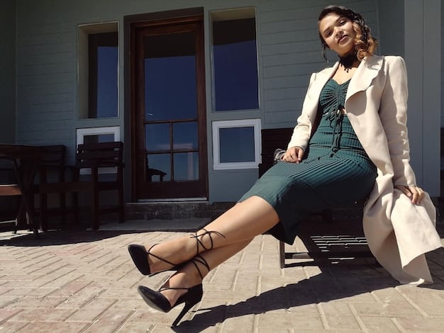 A stylish pair of wide-leg trousers matched with an elegant evening top, showcasing sophisticated transition, complemented by a statement necklace and high heels.