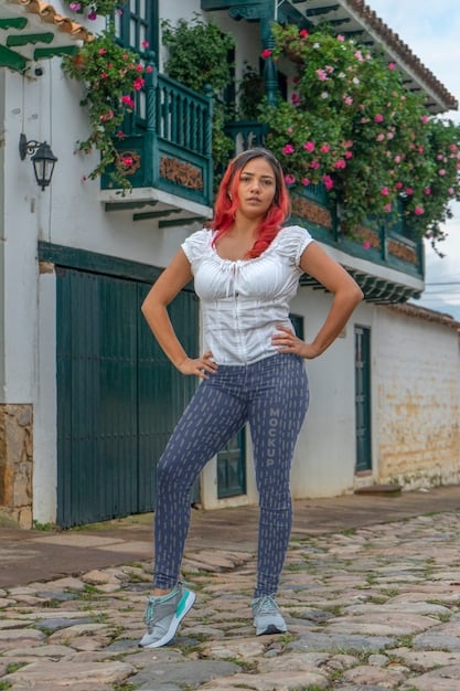 A plus-size woman in her late 20s or early 30s, casually dressed in a trendy Shein outfit, perhaps high-waisted jeans and a stylish graphic tee, strolling through a vibrant city park with a friendly smile.