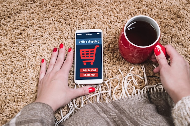 A close-up of a smartphone screen showing a Shein Live Shopping checkout page, with various discount codes applied and a significantly reduced total price, emphasizing successful deal snagging.