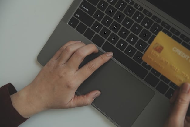 A detailed close-up of a hand holding a credit card, typing on a secure laptop keyboard with a blurred background showing a padlock icon on the browser, emphasizing online security.