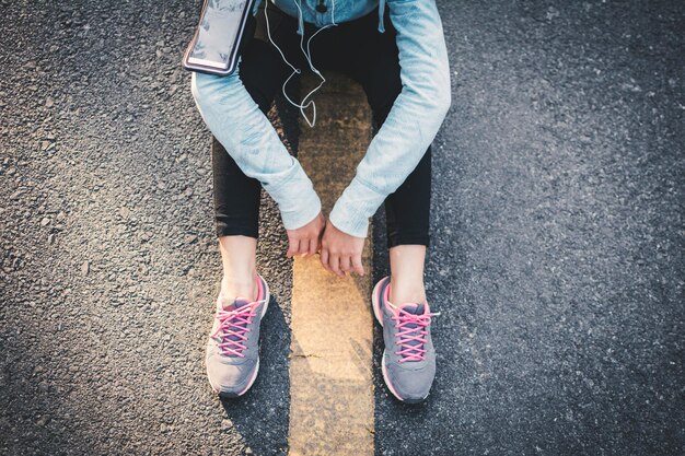 A person's feet after a day of wearing sneakers, showing signs of potential fatigue or discomfort, reflecting the long-term wear test.